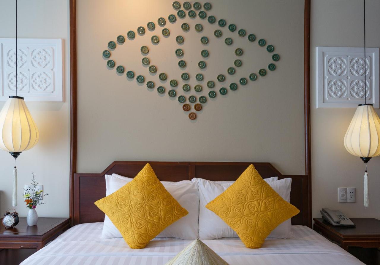 Cozy Savvy Boutique Hotel Hoi An Exterior foto A bedroom at the hotel